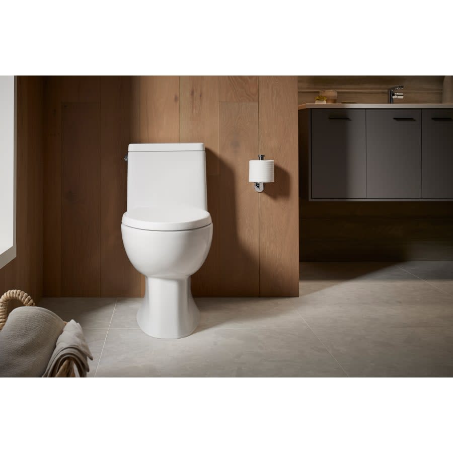 Reach 1.28 GPF One-Piece Compact Elongated Chair Height Toilet with Skirted Trapway and Left Hand Trip Lever - Seat Included