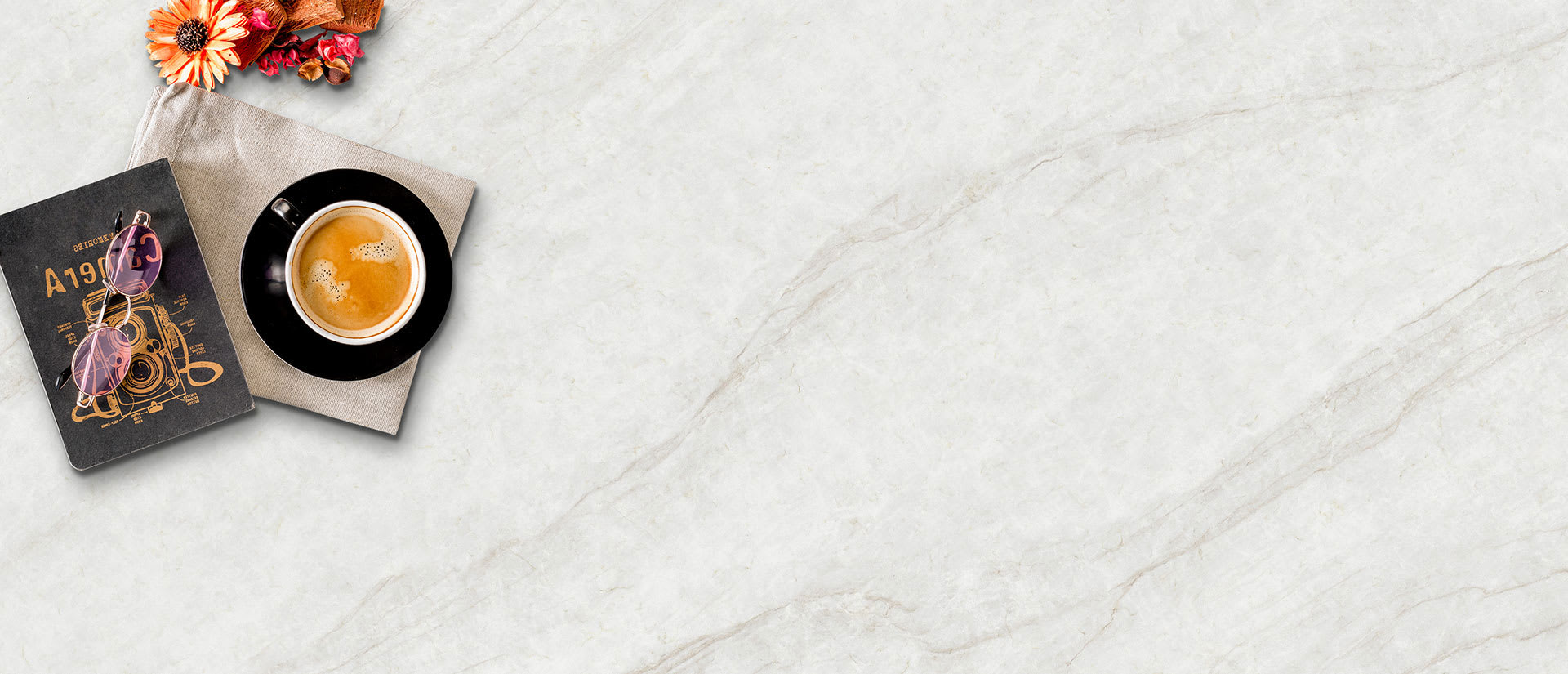 A flat lay of IvoriTaj Brushed Quartz slab by MSI with a soft brushed finish, creamy tones, subtle veining, and ample empty space on the right.