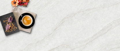 A flat lay of IvoriTaj Brushed Quartz slab by MSI with a soft brushed finish, creamy tones, subtle veining, and ample empty space on the right.