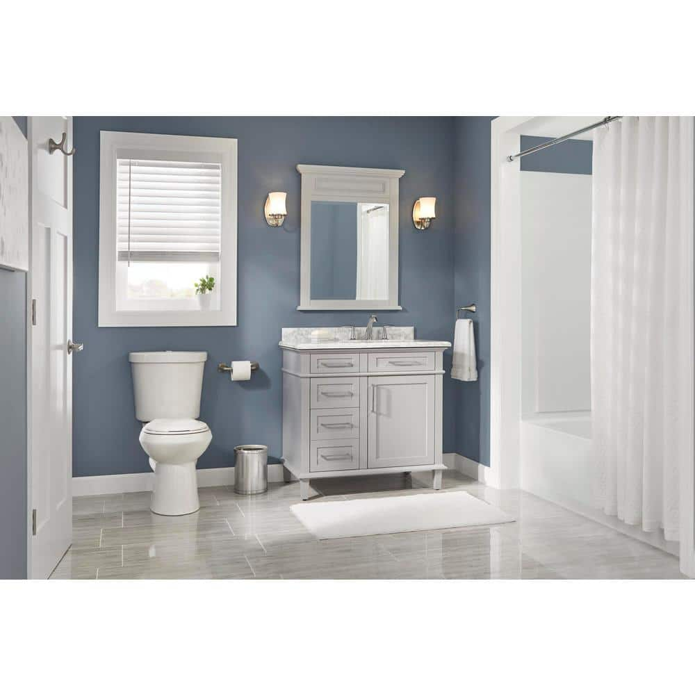 Glacier Bay 2-piece 1.1 GPF/1.6 GPF Dual Flush Round Toilet in White